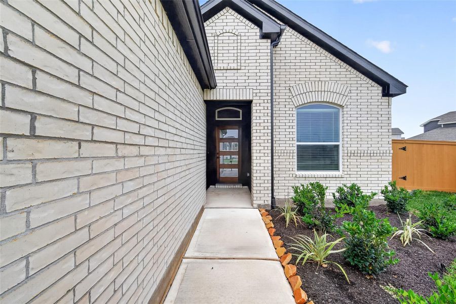Exterior details and patio area of a home in Sunterra, Katy (Image 3).
