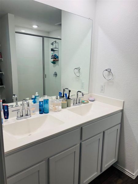 Dual vanity with ample storage and chrome fixtures. Dual vanity with ample storage and chrome fixtures.