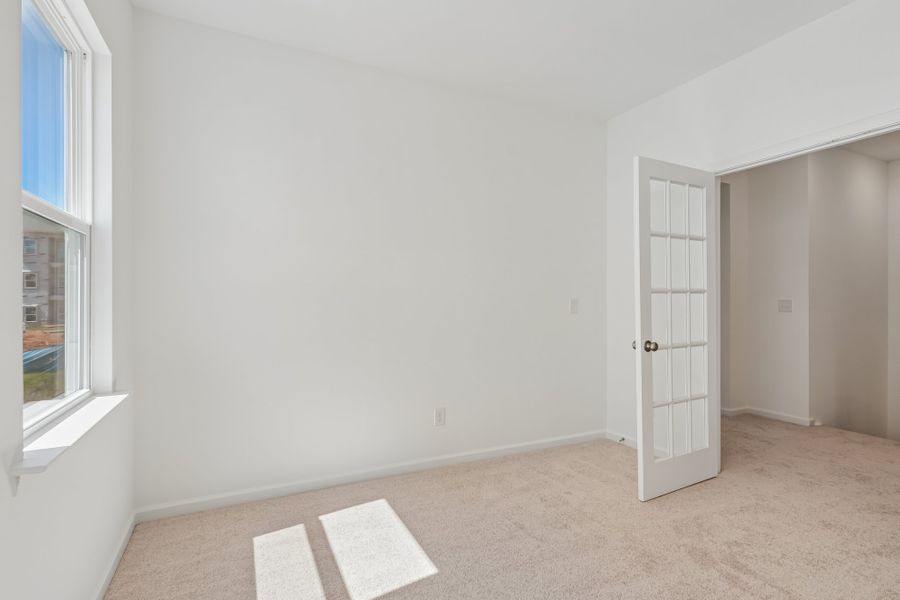Spacious, unfurnished interior of a new home in Terraces at the Exchange, Indian Land (Image 20).