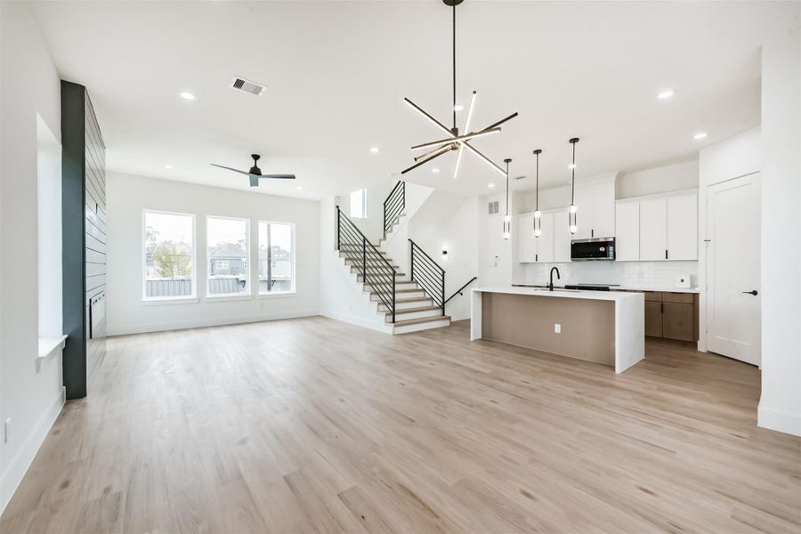 Traveling up to the second floor you will be greeted by the open concept living/kitchen/dining spaces.