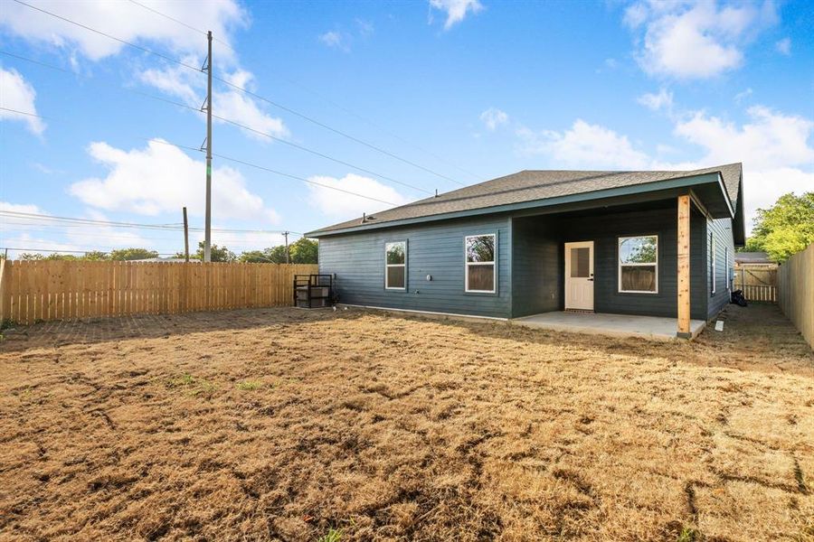 Rear view of house with a patio area