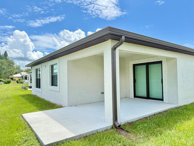 Front exterior of a new home in , Fort Pierce, FL, highlighting curb appeal (Image 23).