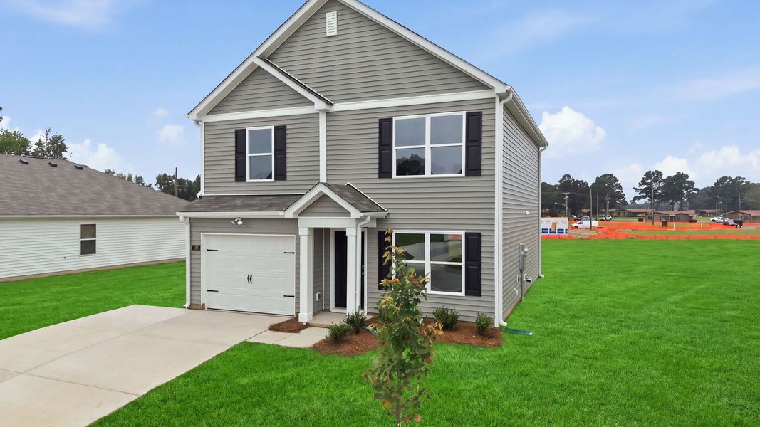 Front exterior of a new home in Hobbs Farm, Ayden, NC, highlighting curb appeal (Image 21).
