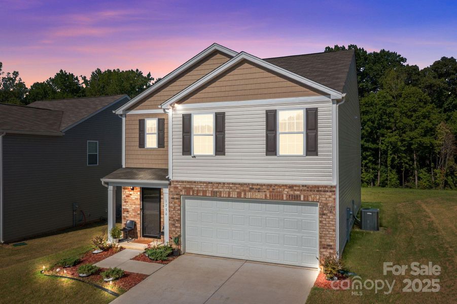 Front exterior of a new home in Mills at Long Creek, Dallas, NC, highlighting curb appeal (Image 24).