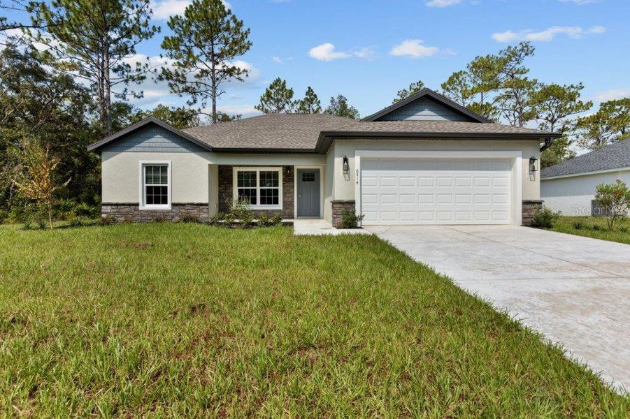 Front exterior of a new home in , Citrus Springs, FL, highlighting curb appeal (Image 19). Front exterior of a new home in , Citrus Springs, FL, highlighting curb appeal (Image 19).