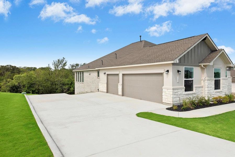 Front exterior of a new home in Double Eagle Ranch, Cedar Creek, TX, highlighting curb appeal (Image 2). Front exterior of a new home in Double Eagle Ranch, Cedar Creek, TX, highlighting curb appeal (Image 2).