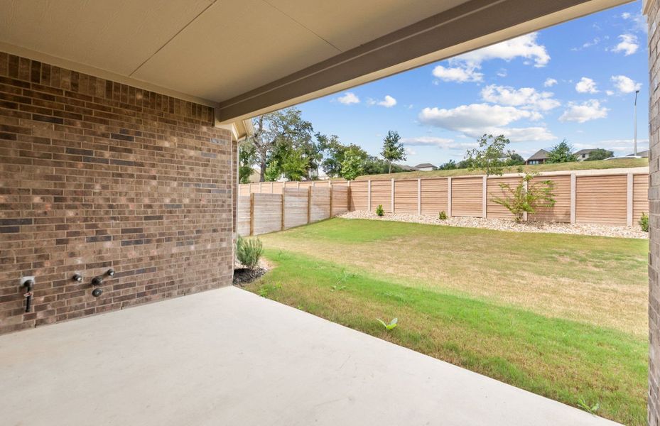 Exterior details and patio area of a home in Bluffview Reserve, Leander (Image 28).