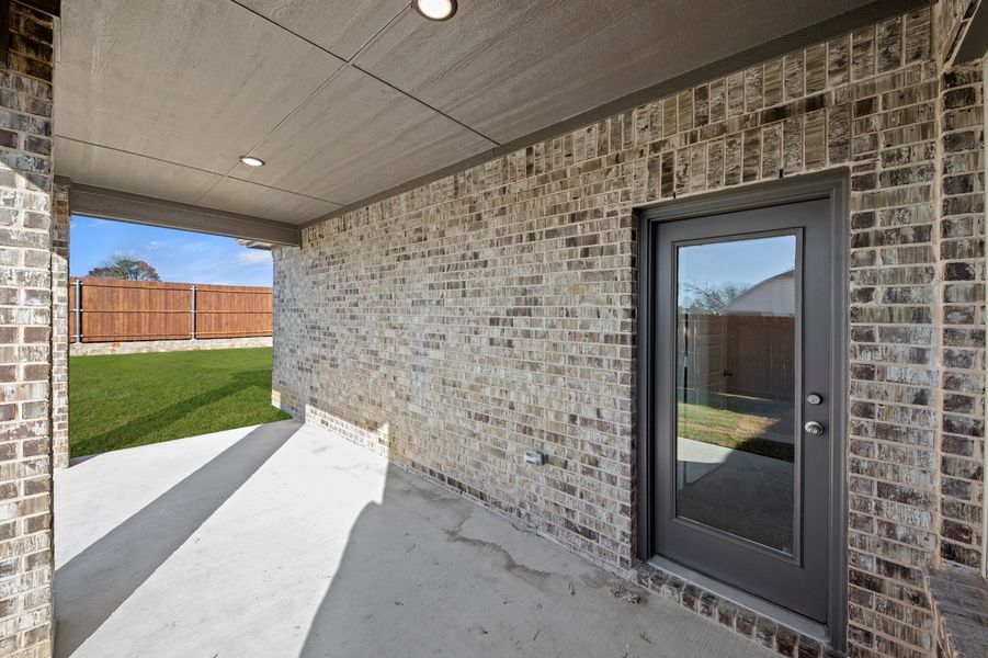 Front exterior of a new home in Keeneland, Aubrey, TX, highlighting curb appeal (Image 28). Front exterior of a new home in Keeneland, Aubrey, TX, highlighting curb appeal (Image 28).
