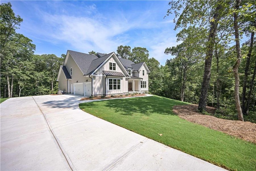 Front exterior of a new home in , Douglasville, GA, highlighting curb appeal (Image 29).