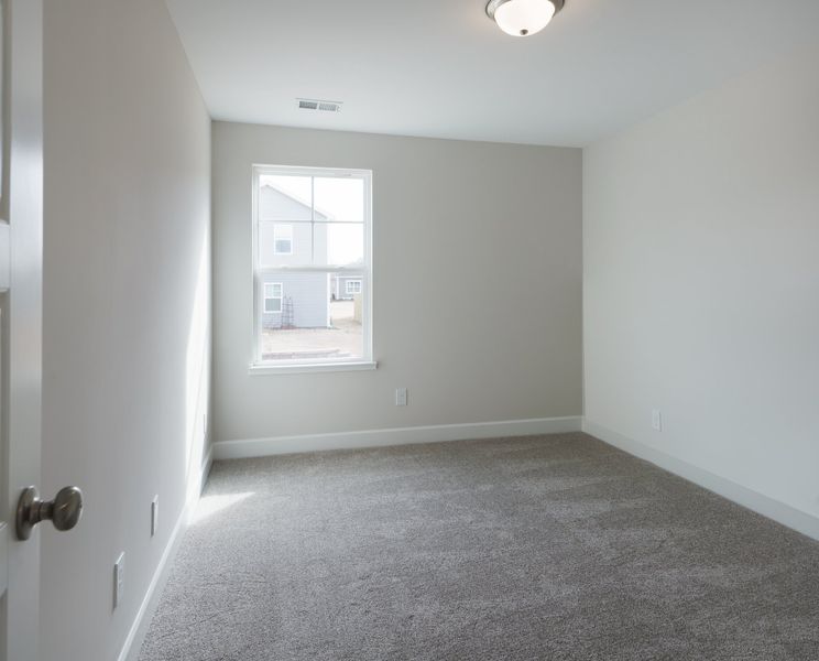 Representative unfurnished interior of a home built from the The Ivory by Cothran Homes in Holly Ridge, Greenville (Image 30).