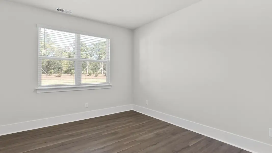 Spacious, unfurnished interior of a new home in The Highlands at Cedar Hill Landing, Navassa (Image 18).