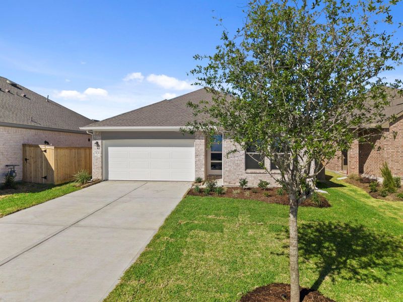 Front exterior of a new home in Windrose Green, Angleton, TX, highlighting curb appeal (Image 23).