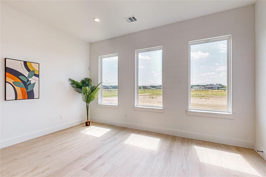 Unfurnished room featuring light hardwood / wood-style flooring