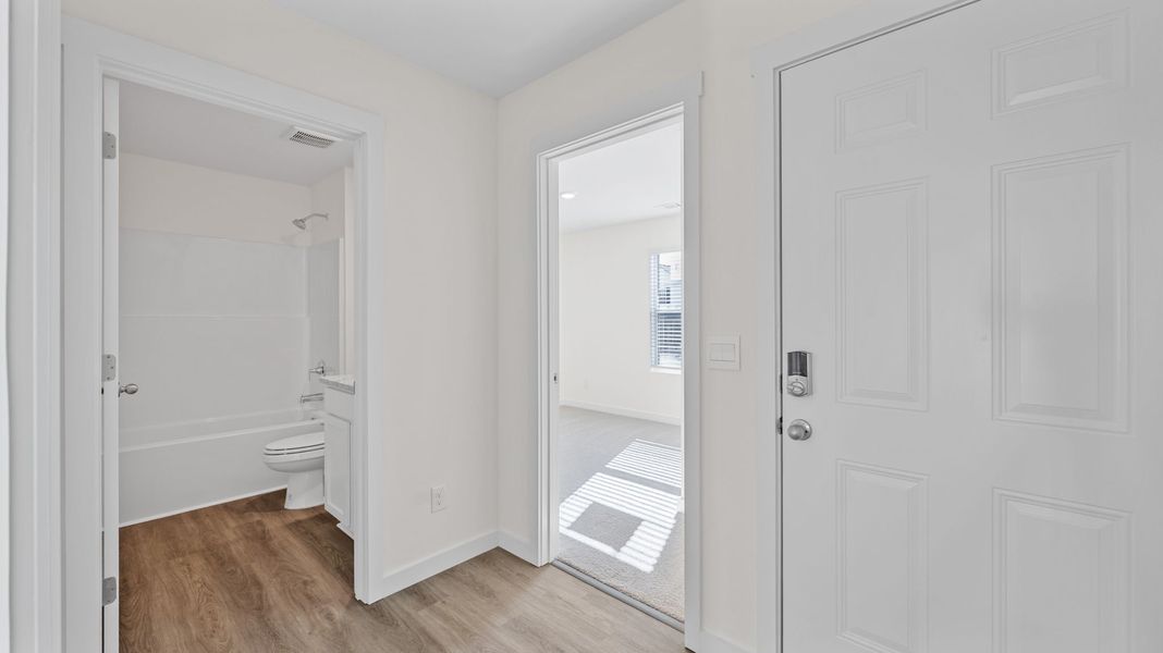 Representative unfurnished interior of a home built from the Sullivan by D.R. Horton in Evergreen Landing, Rossville (Image 9).