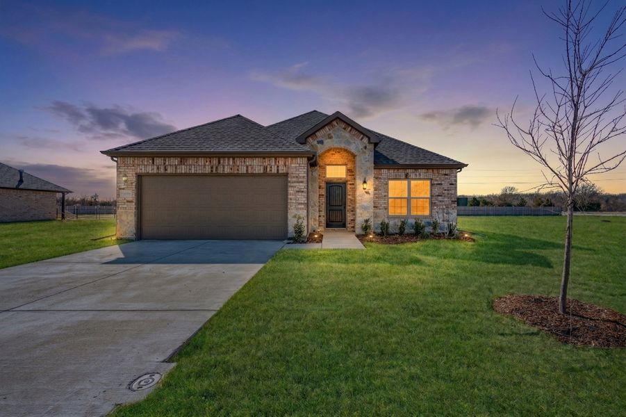 Front exterior of a new home in Mallard Point, Greenville, TX, highlighting curb appeal (Image 2). Front exterior of a new home in Mallard Point, Greenville, TX, highlighting curb appeal (Image 2).
