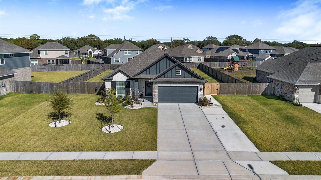 Front exterior of a new home in , Mont Belvieu, TX, highlighting curb appeal (Image 1). Front exterior of a new home in , Mont Belvieu, TX, highlighting curb appeal (Image 1).