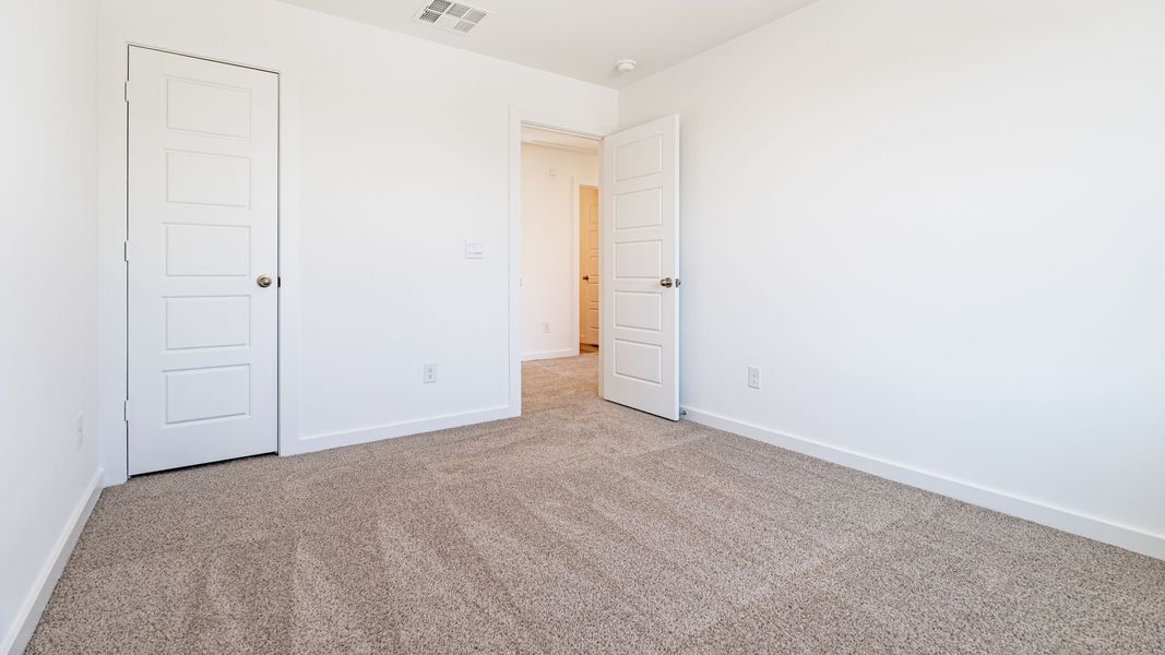 Representative unfurnished interior of a home built from the The Kendall by D.R. Horton in Overlook West, Wolfforth (Image 12).
