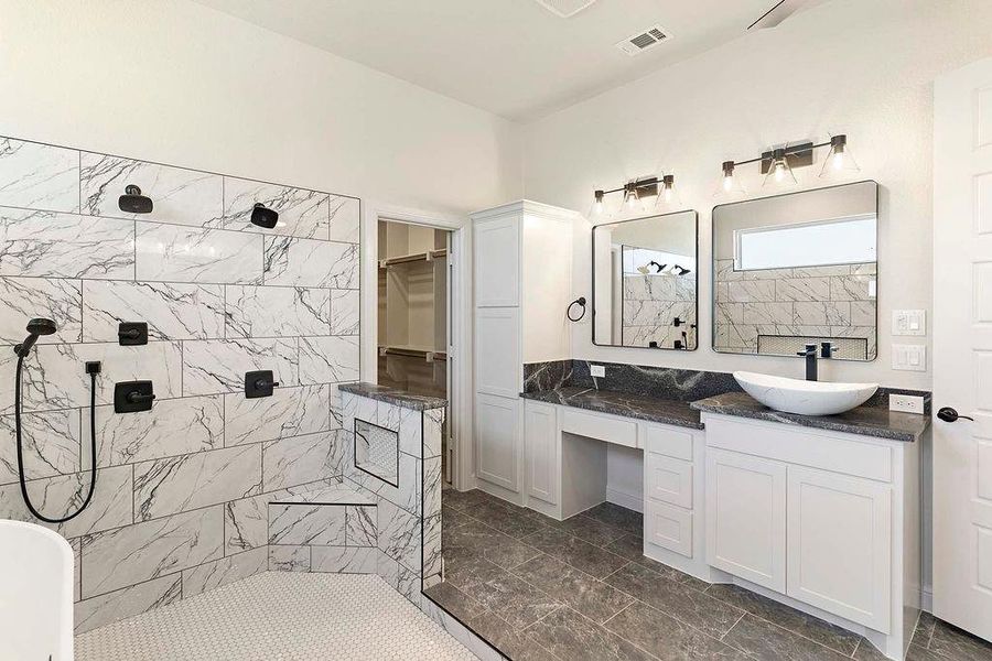 Full bathroom with walk in shower, vanity, and a freestanding bath