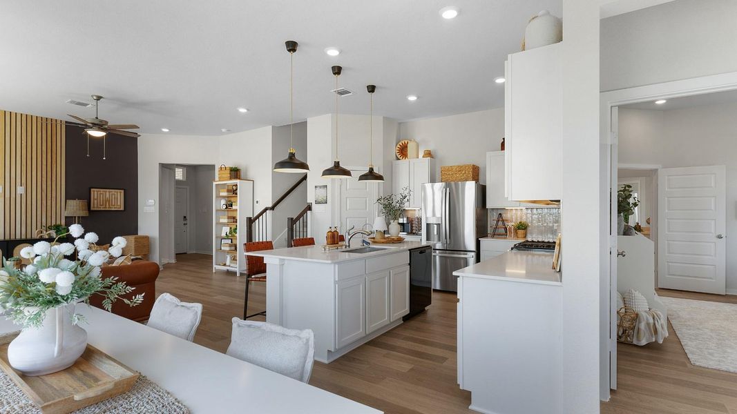 An open concept design seamlessly connects this kitchen and living space, offering both functionality and flow. An open concept design seamlessly connects this kitchen and living space, offering both functionality and flow.