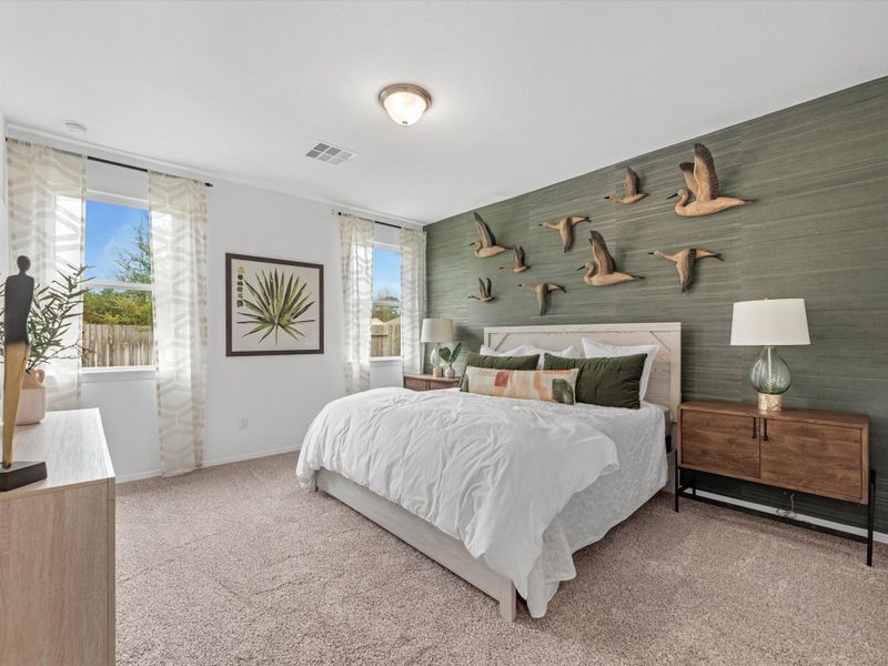 A bedroom with a bed and a lamp. A bedroom with a bed and a lamp.