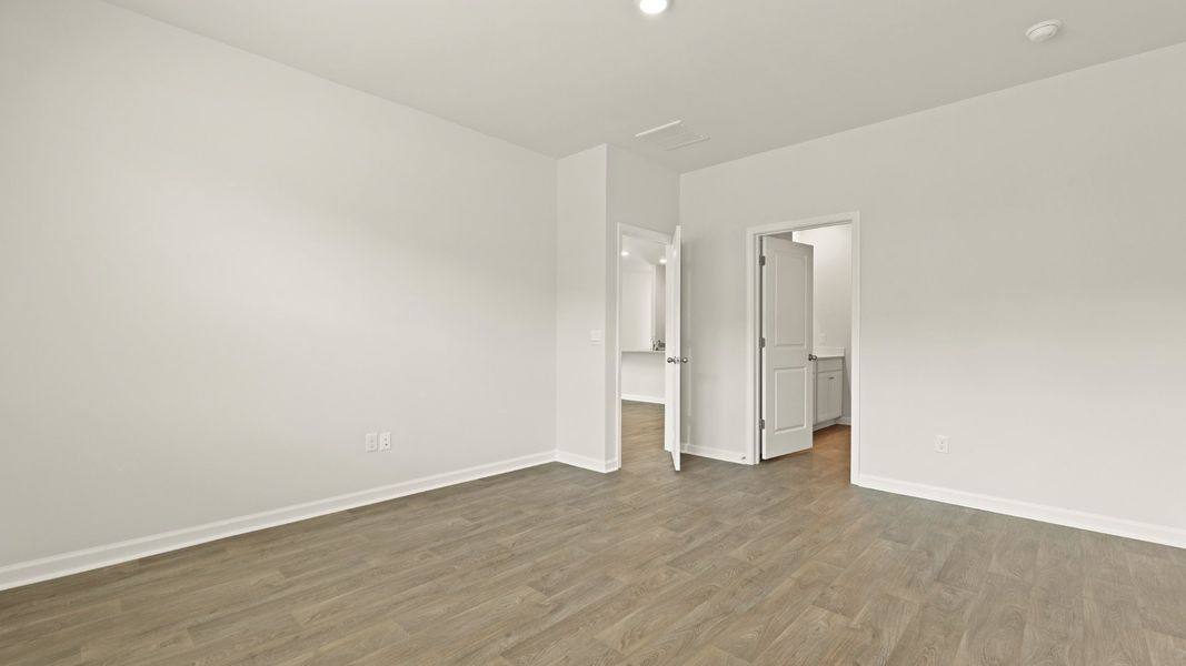 Spacious, unfurnished interior of a new home in Pine Hills at Cane Bay, Summerville (Image 10). Spacious, unfurnished interior of a new home in Pine Hills at Cane Bay, Summerville (Image 10).