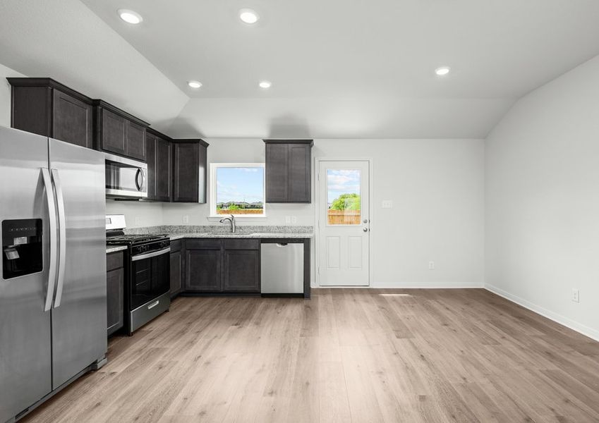 The windows near the kitchen and dining area allow great natural light and backyard views.