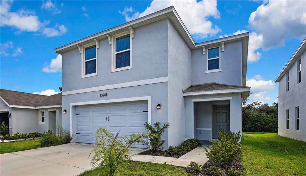 Front exterior of a new home in Heritage Hills, Dade City, FL, highlighting curb appeal (Image 25). Front exterior of a new home in Heritage Hills, Dade City, FL, highlighting curb appeal (Image 25).
