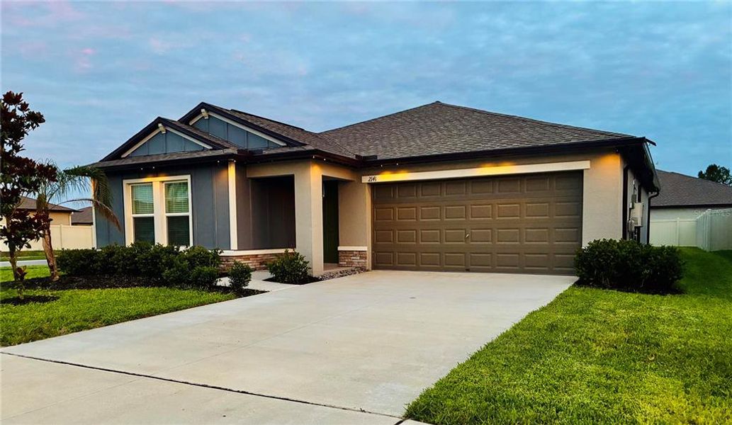 Front exterior of a new home in Two Rivers, Zephyrhills, FL, highlighting curb appeal (Image 21).