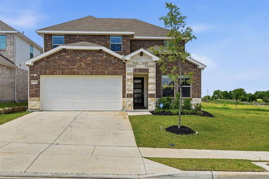 Front exterior of a new home in Briarwood Hills - Highland Series, Forney, TX, highlighting curb appeal (Image 27). Front exterior of a new home in Briarwood Hills - Highland Series, Forney, TX, highlighting curb appeal (Image 27).
