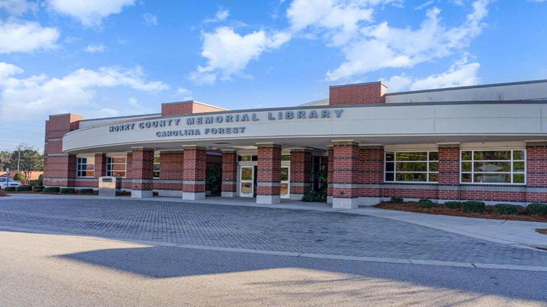 Front exterior of a new home in The Reserve at Wild Horse, Conway, SC, highlighting curb appeal (Image 12).