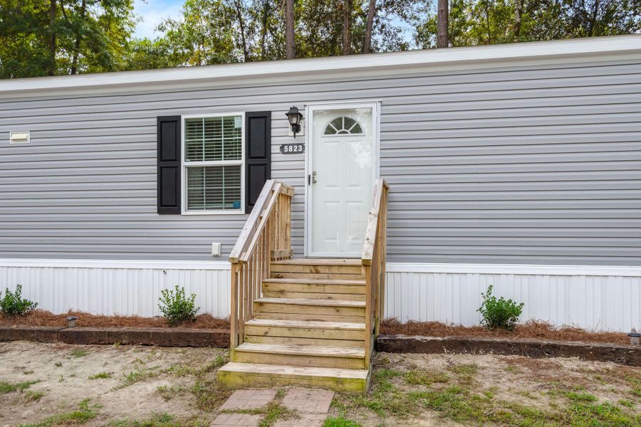 Exterior details and patio area of a home in , Ravenel (Image 13). Exterior details and patio area of a home in , Ravenel (Image 13).