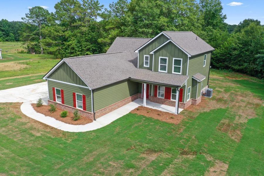 Front exterior of a new home in , McDonough, GA, highlighting curb appeal (Image 14).
