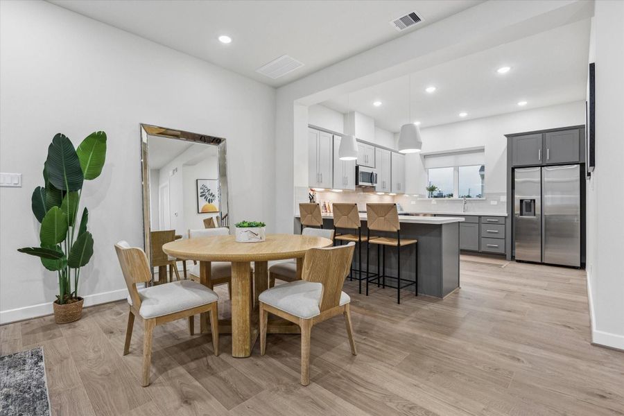 breakfast and formal dining space - Photo is of model at 6340, finishes are similar. breakfast and formal dining space - Photo is of model at 6340, finishes are similar.