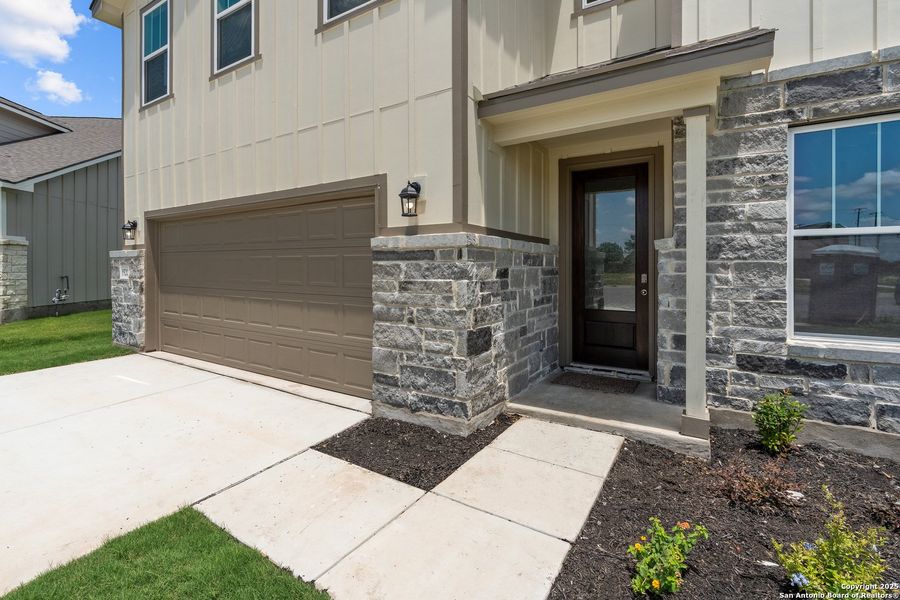 Exterior details and patio area of a home in Weltner Farms 50’s, New Braunfels (Image 4).
