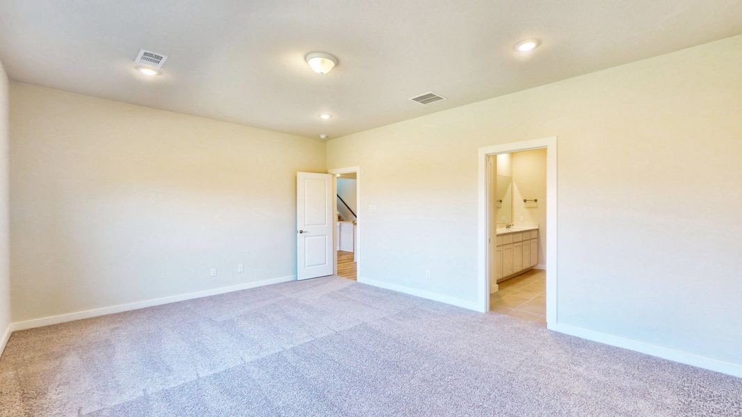 A room with a carpet and a blue carpet.