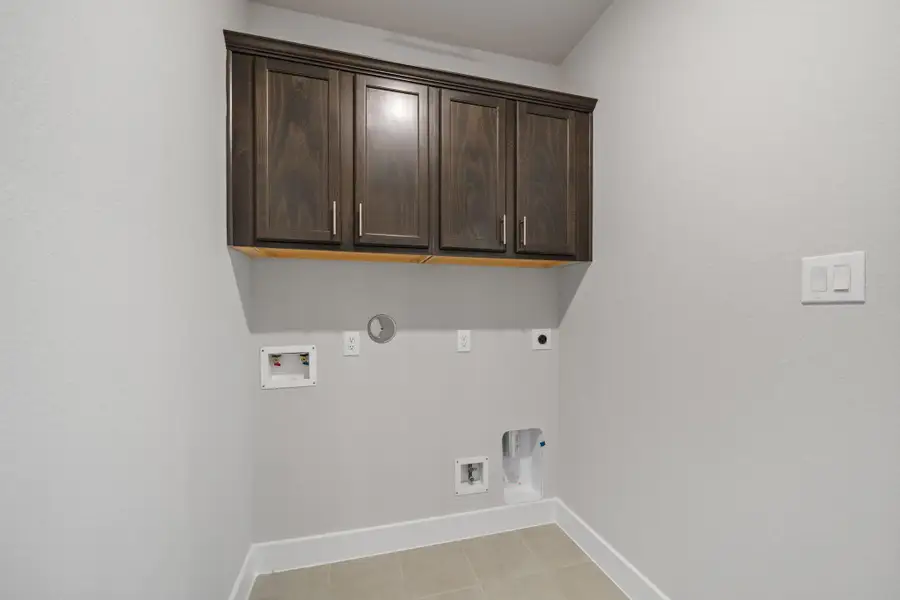 This utility room also boasts stunning cabinetry that stretches to the ceiling for additional storage. This utility room also boasts stunning cabinetry that stretches to the ceiling for additional storage.