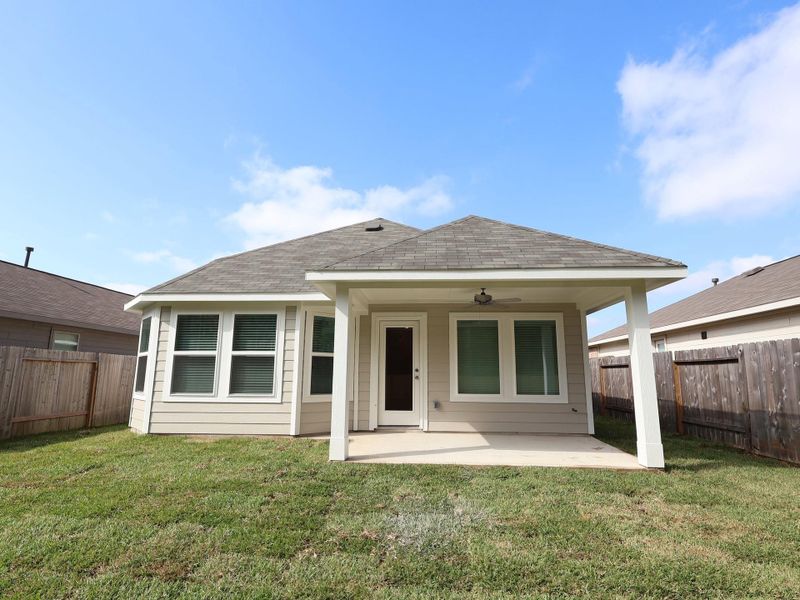 Exterior details and patio area of a home in Magnolia Ridge, Magnolia (Image 4).