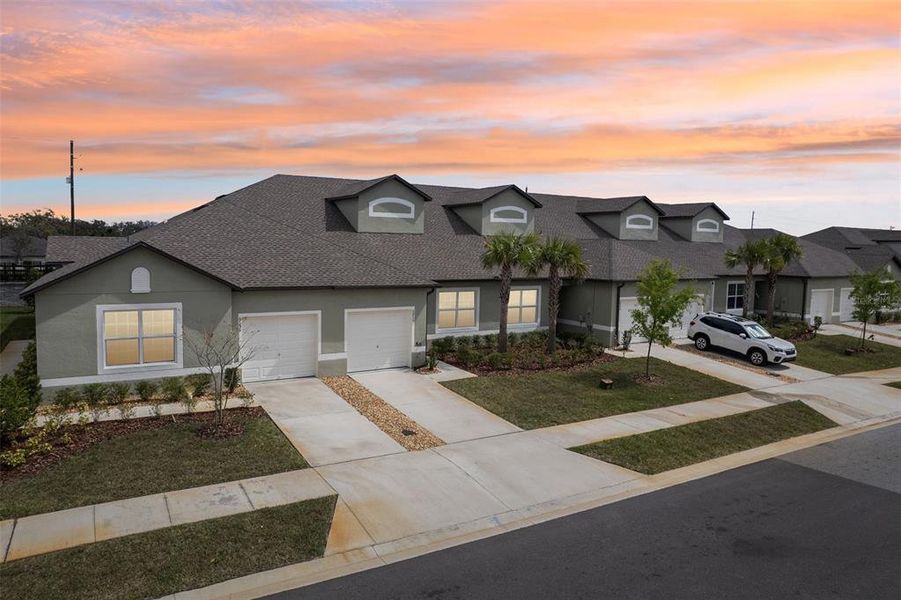 Front exterior of a new home in Abbott Square: The Villas, Zephyrhills, FL, highlighting curb appeal (Image 29). Front exterior of a new home in Abbott Square: The Villas, Zephyrhills, FL, highlighting curb appeal (Image 29).