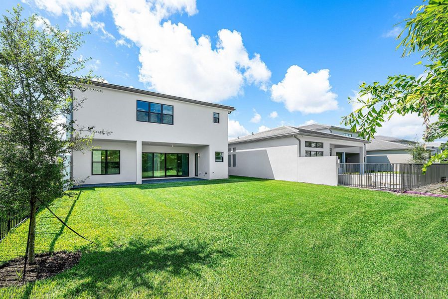 Front exterior of a new home in Lotus Edge, Boca Raton, FL, highlighting curb appeal (Image 42).