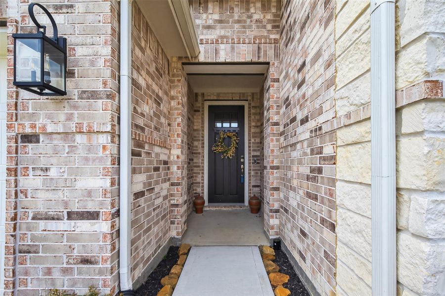 Inviting front entrance with stylish exterior lighting and a welcoming façade