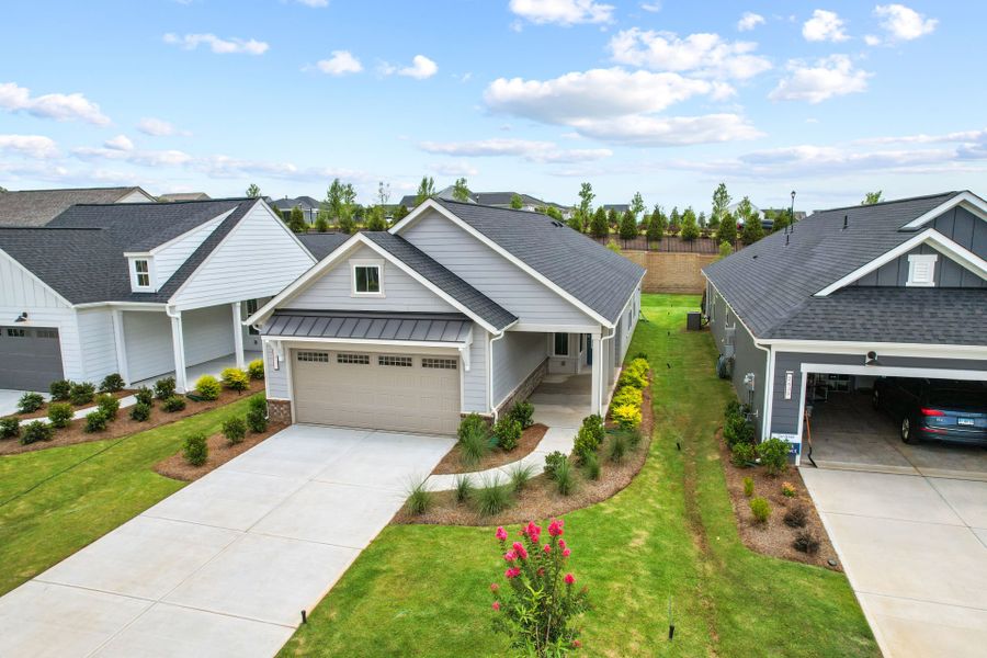 Front exterior of a new home in Carolina Riverside, Belmont, NC, highlighting curb appeal (Image 33). Front exterior of a new home in Carolina Riverside, Belmont, NC, highlighting curb appeal (Image 33).