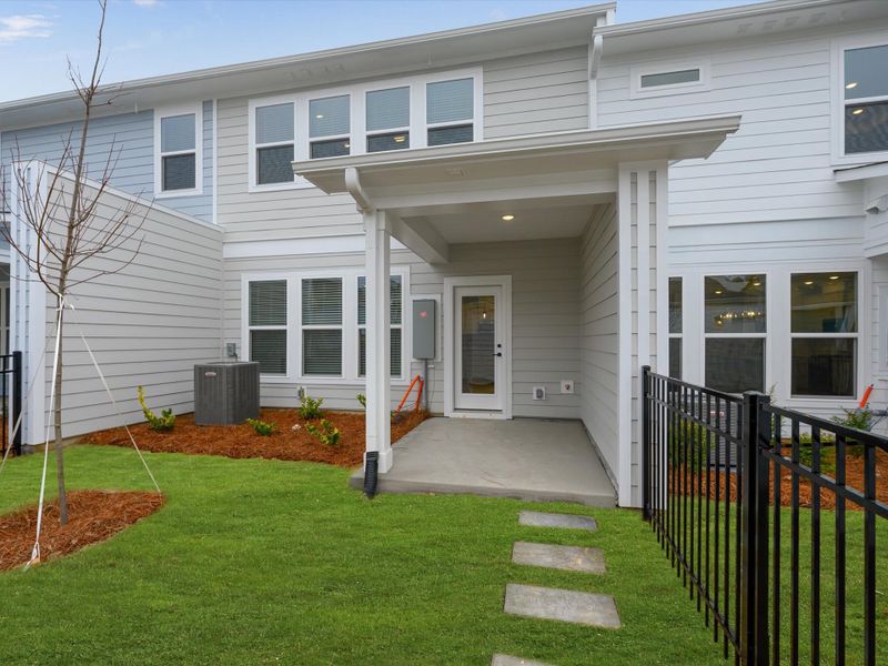 Exterior details and patio area of a home in North Creek Village - Townhomes, Huntersville (Image 3).