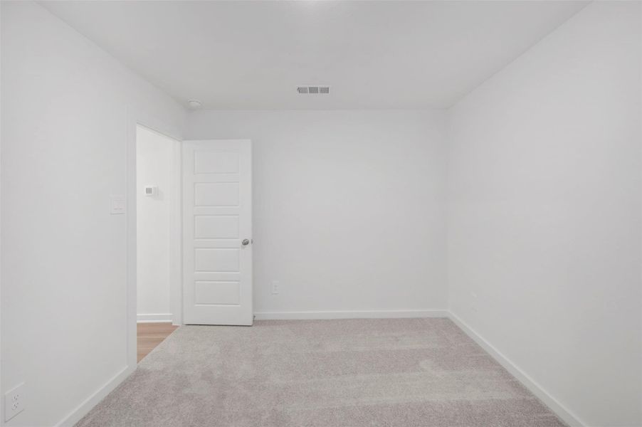 Spacious, unfurnished interior of a new home in Pinewood at Grand Texas, New Caney (Image 17).
