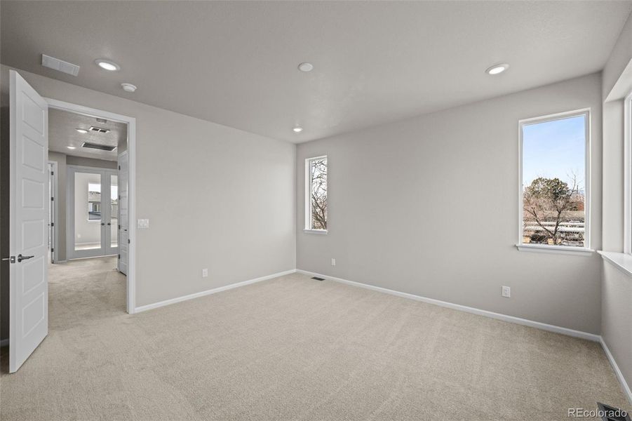 Spacious, unfurnished interior of a new home in Ralston Creek, Arvada (Image 29).