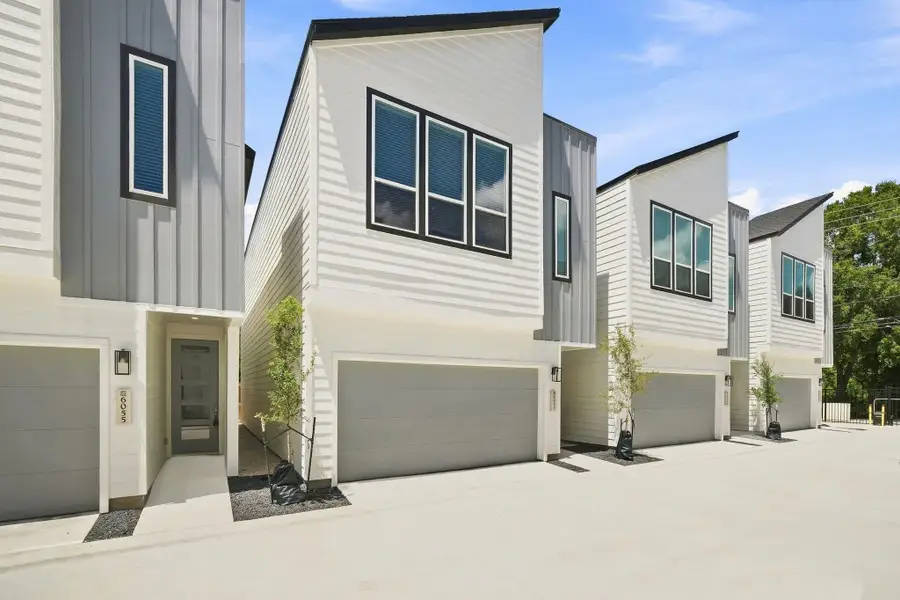 Attractive contemporary elevation showcasing modern architectural details, contrasting finishes, and an attached two-car garage. Attractive contemporary elevation showcasing modern architectural details, contrasting finishes, and an attached two-car garage.