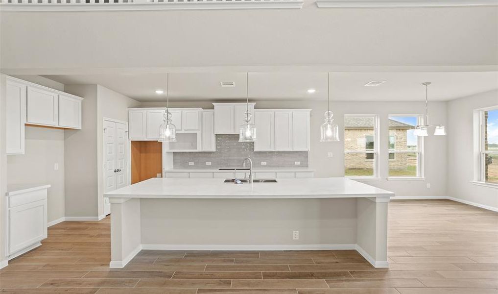 View of kitchen and dining area (*Photo not of actual home and used for illustration purposes only.)