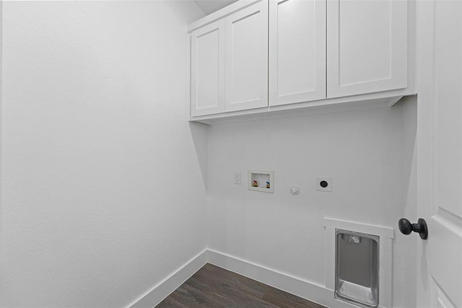 Laundry area featuring wood-finish flooring, white shaker-style cabinetry, and a dedicated utility sink Laundry area featuring wood-finish flooring, white shaker-style cabinetry, and a dedicated utility sink