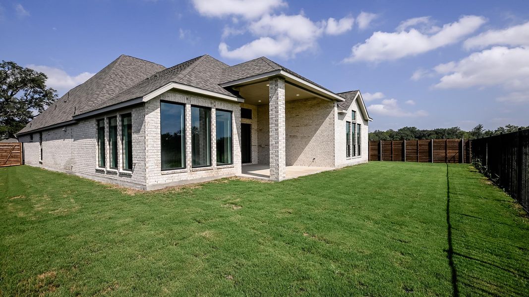 Exterior details and patio area of a home in Juniper Springs, Lockhart (Image 3).