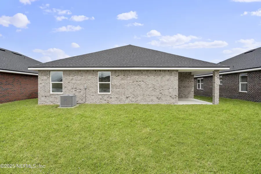 Exterior details and patio area of a home in Shadow Crest at Rolling Hills, Green Cove Springs (Image 3).