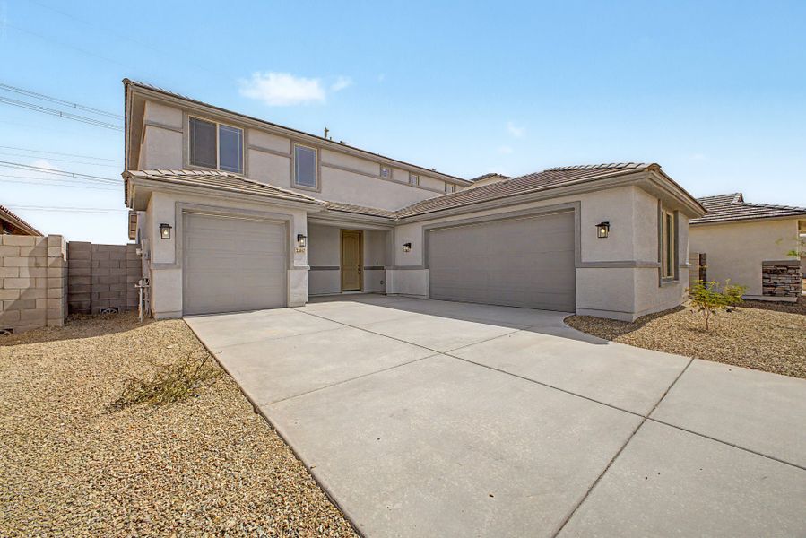Front exterior of a new home in Bentridge, Buckeye, AZ, highlighting curb appeal (Image 1). Front exterior of a new home in Bentridge, Buckeye, AZ, highlighting curb appeal (Image 1).